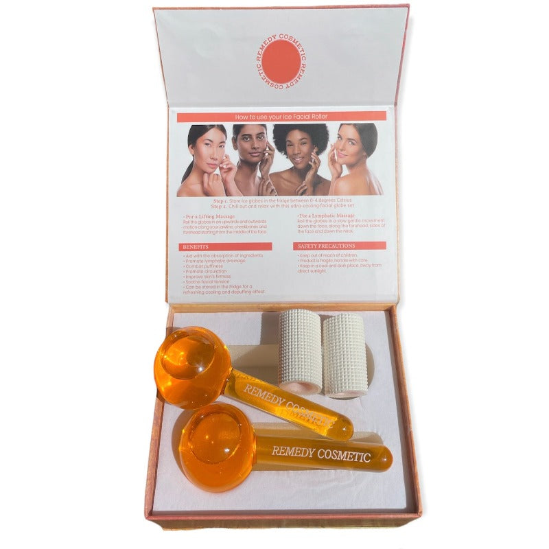 Beautiful and luxurious orange ice globe massage tool cooling facial set from Remedy Cosmetic Beauty, open set with nice and fresh orange ice globes and white handles