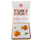 Beautiful and luxurious orange ice globe massage tool cooling facial set from Remedy Cosmetic Beauty, open set with nice and fresh orange ice globes and white handles on it perfectly presented in the box