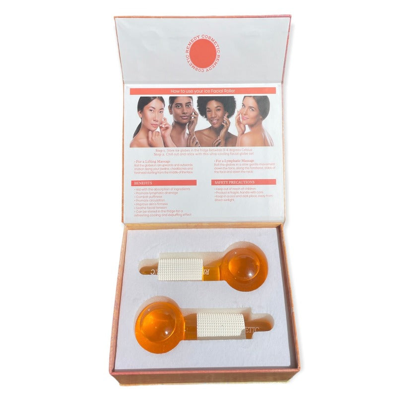 Beautiful and luxurious orange ice globe massage tool cooling facial set from Remedy Cosmetic Beauty, open set with nice and fresh orange ice globes and white handles on it perfectly presented in the box